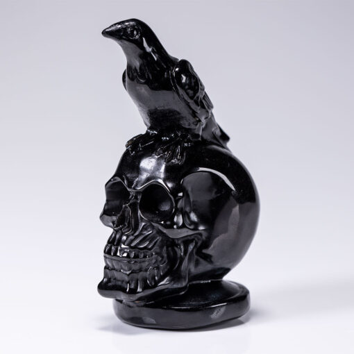 wholesale-obsidian-skull-with-crow-carving-for-sale