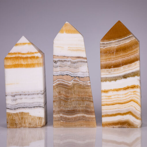 wholesale-banded-honey-calcite-point-towers-for-sale
